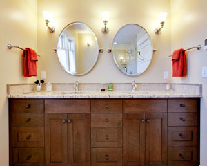 A double sink for ease of use'cherry cabinets and Giallo Ornamental granite