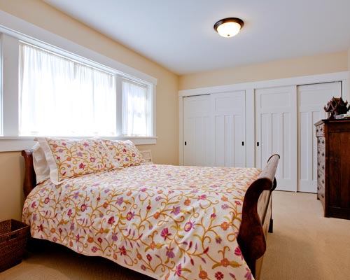 This room is so large, comfortable and bright, it's hard to believe it's a basement bedroom