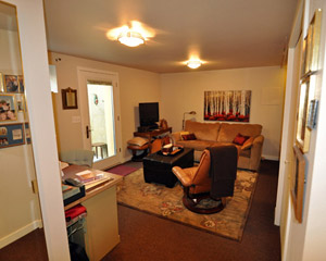 The finished space is comfortable, warm and functional, with a main living room/bedroom that includes a nook for a computer