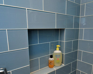 The niche next to the shower controls provides added shelf space for soap.  The niche had to be located precisely so that it would fit exactly in the vertical width of the tiles