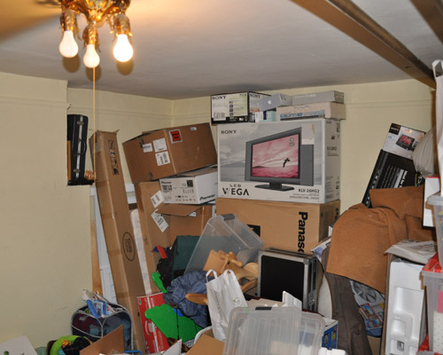 Before: a storage room with a master bath in its future.