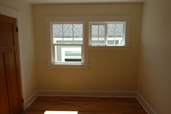 The bedroom selected for conversion to the bath included a number of windows in less than ideal locations