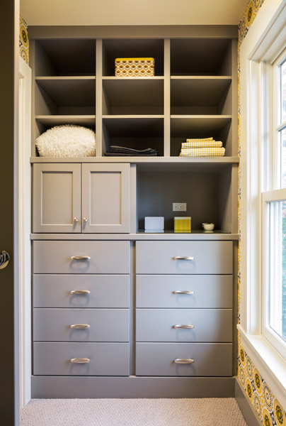 Imported wallpaper and more built-ins at the closet, where the window was replaced as well