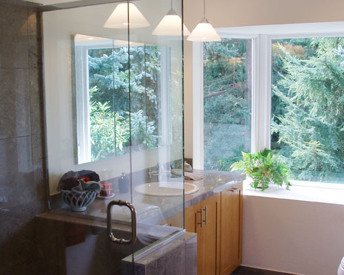 This small bathroom was designed in many spaces down to 1/16 of an inch.  Making every bit of space count was the top priority, along with bringing in lots of light and using fine materials.