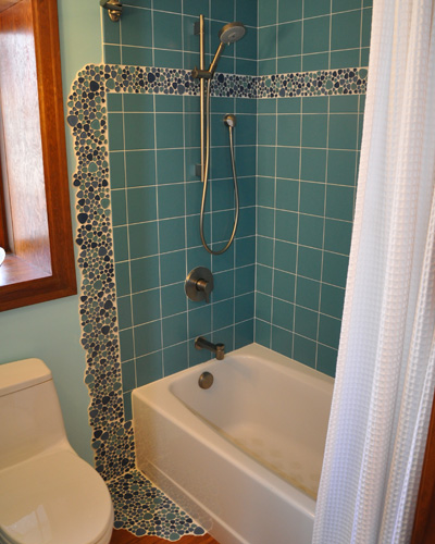 After seeing how great it looked at the vanity, the clients decided to repeat the pool at the tub/shower area.  The results are striking. Custom tile bathroom Seattle