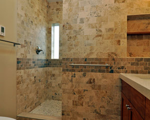 It's hard to know whether that vanity or the shower is the star here.  The shower benefits from a relocated and re-sized window, which provides a narrow, obscured-glass peek of natural light, while illuminated from above with a new solar-powered operable skylight.  It is full depth, using all the space that had been unused with the tub installation