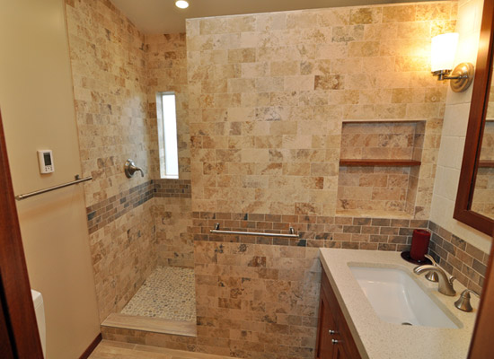 The tangible results of this big remodel of a small space: lots of low-key storage, a private and spacious shower with elegant finishes, and a sink area that is both ample and functional.  Now this family of three is happy to share this elegant and soothing space