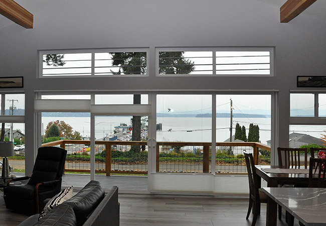 Windows in great room show off views in West Seattle custom home