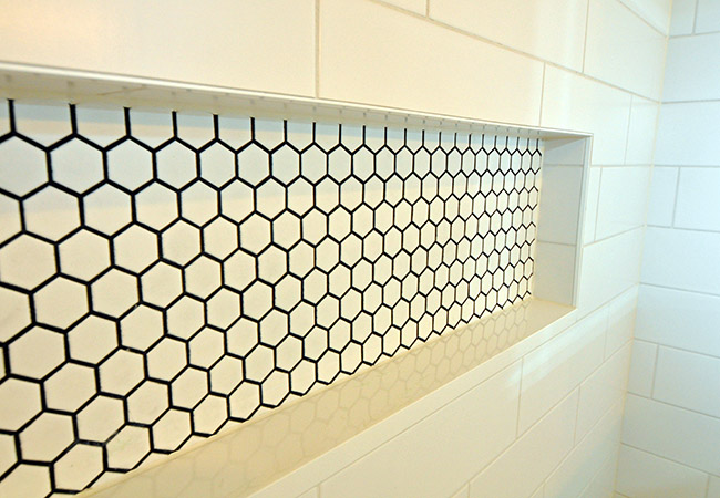 Closeup of tiled shower shelf