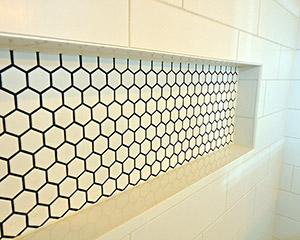 Close up view of bathroom shower shelf tiles