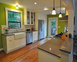 The changes--some subtle and some more significant--have made all of the spaces more functional. Replacing a window in the kitchen with a door makes access to the back yard easier. Deleting the other door means a window is now visible from the dining room instead