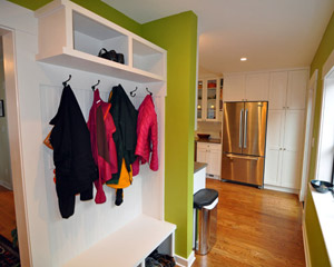 That wide hall now has enough space for a built-in-place mudroom bench and cubbies. Seattle custom storage projects