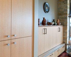 The initial inclination was to build the new cabinets entirely in anigre - and indeed, that intention was realized not just at that transition point, but throughout the kitchen