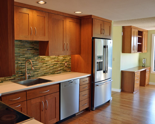 The close eye on budget allowed enough money to also improve a desk area just off the kitchen.  Gone are the furniture pieces in favor of built-in cabinets and desktop that match those in the kitchen