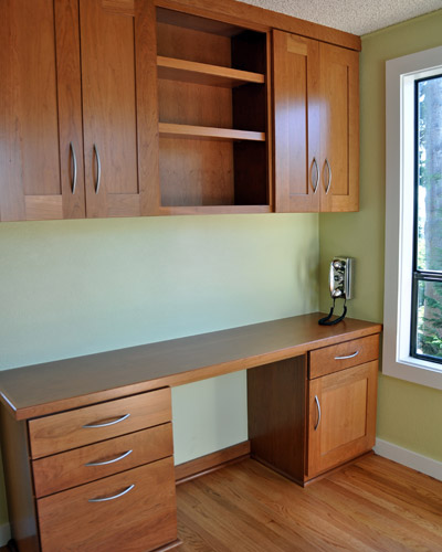 Here and in the kitchen the red oak floors are refinished with Swedish finish.  We also replaced window and door trim and painted in both rooms