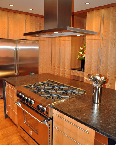 The range hood required a custom-built shroud to create a seamless connection with the ceiling