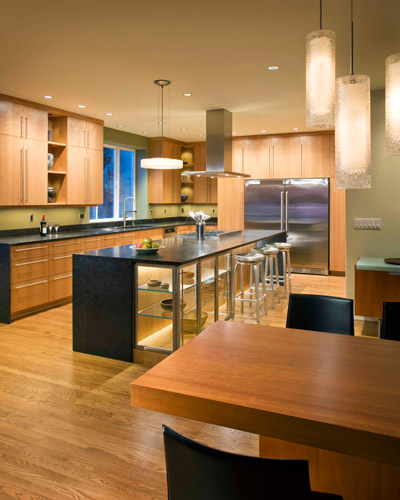 From the dining room table, the kitchen is now accessible and beautiful