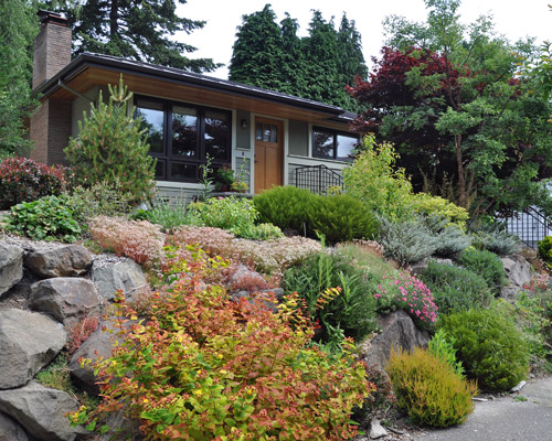 The revised home includes new Milgard Essence windows on two sides of the home - a second phase is planned down the line... - a new entry door and metal roofing for longevity and the possibility of solar in the future