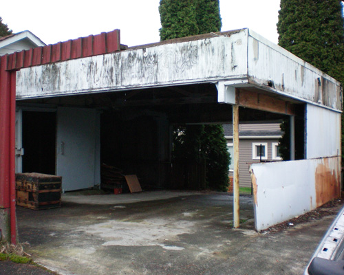 The old garage had been worked on by family, but it had seen better days.  The extension on the original garage was taking up valuable parking space, and all the materials were rotting and rusting