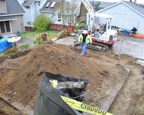 After removing the old garage, the new footings and foundation were excavated in preparation for pouring concrete